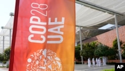 A sign for the COP28 U.N. Climate Summit is displayed in Dubai, United Arab Emirates, Nov. 29, 2023. 