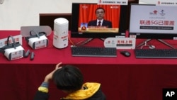 FILE - Chinese 5G technologies are demonstrated in Beijing, March 6, 2019. Beijing's emergence as a competitor in key technologies has rattled other governments that see Chinese competition as a threat to their economic and security interests.