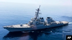 FILE - The USS Paul Hamilton is seen after passing through the Strait of Hormuz, May 19, 2023. 