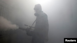 A health worker fumigates in a residential area, as Sri Lanka tries to curb dengue fever across the island in Colombo, Sri Lanka, July 12, 2023. 