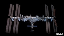This image depicts the International Space Station pictured from the SpaceX Crew Dragon Endeavour during a fly around of the orbiting lab. (Image Credit: NASA)
