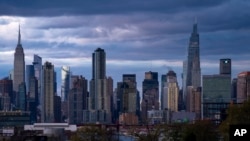 FILE - The New York skyline, Nov. 13, 2022. New York will move forward with its plan to charge drivers extra in tolls to enter the core of New York City, part of an effort to reduce congestion, improve air quality, and raise funds for public transit.