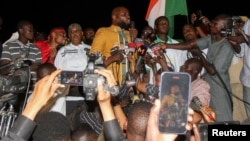 Kemi Seba, a Franco-Beninese firebrand pro-Russia activist, speaks to supporters of the junta that seized power in Niger in July, during a rally near the French military base, calling for the withdrawal of French forces, in Niamey, Niger, Sept. 28,2023.