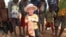 FILE - A 3-year-old boy with albinism is seen with his friends at their family home in this May, 23, 2016, photo in Machinga, Malawi.