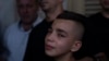 Mohammed, brother of Fares Sharhabil Abu Samra, 14, cries during his funeral in the West Bank city of Qalqilya on July 27, 2023. The Palestinian Health Ministry said that Abu Samra was killed by Israeli fire.