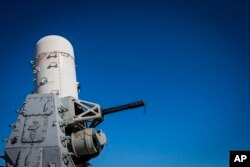 FILE - A 20mm Phalanx CIWS weapons defense cannon is mounted on the U.S. Navy destroyer USS Gravely, March 14, 2023. The U.S. military said Sunday it shot down two anti-ship ballistic missiles fired toward a container ship by Yemen’s Houthi rebels in the Red Sea.