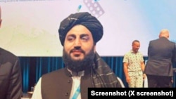 Abdul Bari Omar, head of the Taliban-led food and medicine authority, poses in this undated photo at the 2nd World Local Production Forum in the Hague in November. The photo was posted to the social media platform, X.