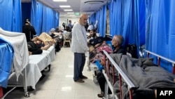 Patients and internally displaced people are pictured at Shifa hospital in Gaza City on Nov. 10, 2023, amid ongoing battles between Israel and Hamas. 