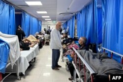 Patients and internally displaced people are pictured at Shifa hospital in Gaza City, Nov. 10, 2023, amid ongoing battles between Israel and Hamas.