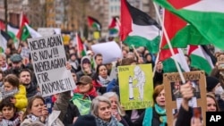 Demonstrators rally against Israel's President Isaac Herzog attending the opening of the new National Holocaust Museum in Amsterdam, Netherlands, March 10, 2024.