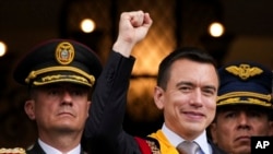 Newly sworn-in President Daniel Noboa waves from a balcony of the Carondelet presidential palace in Quito, Ecuador, Nov. 23, 2023. 