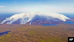 FILE - Wildfires burn in Shelburne County, Nova Scotia, May 31, 2023. (Communications Nova Scotia/The Canadian Press via AP)