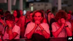 People gather during a demonstration in solidarity with friends and relatives held hostage in the Gaza Strip, in Tel Aviv, Israel, Nov. 3, 2023.