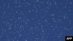 Flyers dropped by the Israeli military over Gaza City warn residents to flee "immediately" to the south. A map featured on the flyers showed an arrow pointing south across a line in the central Gaza Strip, Oct. 13, 2023.