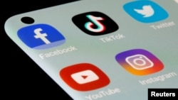 FILE - Facebook, TikTok, Twitter, YouTube and Instagram apps are seen on a smartphone in this illustration taken July 13, 2021.