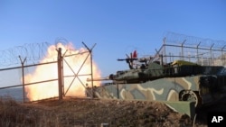 In this photo provided by South Korea Defense Ministry, South Korea's tank fires during a fire exercises at the Northwest Islands area in South Korea, Jan. 5, 2024. 