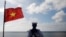 FILE - A Vietnamese naval soldier stands guard at Thuyen Chai island in the Spratly archipelago in the South China Sea on Jan. 17, 2013. 