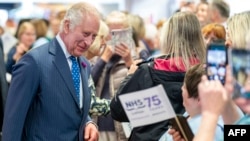 Britain's King Charles III and Queen Camilla visit the Royal Infirmary of Edinburgh, in Edinburgh, July 4, 2023, to celebrate 75 years of Britain's National Health Service.