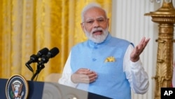 India's Prime Minister Narendra Modi speaks during a news conference with President Joe Biden in the East Room of the White House, June 22, 2023, in Washington.