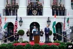 President Joe Biden listens as India's Prime Minister Narendra Modi speaks during a State Arrival Ceremony on the South Lawn of the White House, June 22, 2023, in Washington.