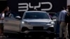 File - Visitors examine BYD ATTO 3 in Munich, Germany, Sept. 8, 2023. China's car industry groups say the country is set to surpass Japan to become the world's top car exporter for 2023, driven by the Russian market and a growing global appetite for electric vehicles.
