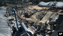A farm storage building is seen damaged after a Russian attack in the Odesa region, Ukraine, July 21, 2023. Missiles injured two people, damaged equipment and destroyed 100 metric tons of peas and 20 metric tons of barley, regional Gov. Oleh Kiper said. 