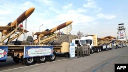 A handout photo provided by the Iranian Army media office Dec. 10, 2023, shows Iranian Karrar drones during their unveiling in Tehran.