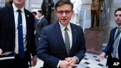 FILE — U.S. House Speaker Mike Johnson walks on Capitol Hill in Washington, Jan. 18, 2024. Johnson has argued that a hardline House bill is the solution to America's border woes. 