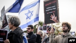 Supporters of Israel, members of the Jewish community and hostages' families and friend attend a rally calling for the release of hostages held by Hamas, near the United Nations' European headquarters in Geneva, Oct. 22, 2023.