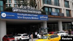 FILE - A visa application center of VFS Global in Istanbul, Turkey, Aug. 25, 2022. The U.S. State Department is working on a pilot program that would allow some work visa holders in the U.S. to renew their visas in the U.S., rather than travel to their home countries. 