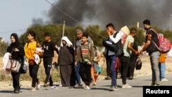Palestinians fleeing north Gaza move south amid the ongoing conflict between Israel and Hamas, in the central Gaza Strip, Nov. 10, 2023.