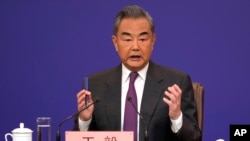 Chinese Foreign Minister Wang Yi speaks during a press conference on the sideline of the National People's Congress in Beijing, March 7, 2024. 