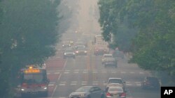 The White House is hidden behind a layer of hazy smoke, Thursday, June 8, 2023, in Washington. Smoke from Canadian wildfires is pouring into the US East Coast and Midwest and covering the capitals of both nations in an unhealthy haze.