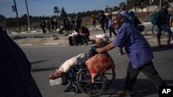 Palestinians flee to the southern Gaza Strip on Salah al-Din Street in Bureij, Gaza Strip, Nov. 10, 2023.
