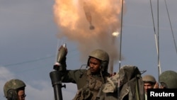 Israeli soldiers fire mortar shells near Israel's border with Gaza in southern Israel, Jan. 3, 2024.