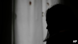  A 26-year-old woman, who declined to give her name for security reasons, speaks in safe house for women in Belgrade, Serbia, Nov. 23, 2023. 