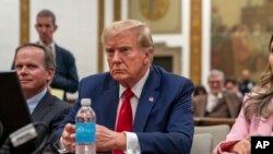 FILE - Former U.S. President Donald Trump attends the Trump Organization civil fraud trial in New York State Supreme Court, Dec. 7, 2023, in New York. 
