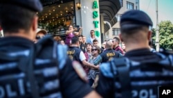 Police officers block protesters during the LGBTQ Pride March in Istanbul, Turkey, June 25, 2023.