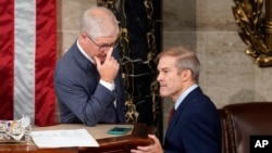 Temporary House leader Rep. Patrick McHenry, left, talks with Rep. Jim Jordan, as Republicans try to elect Jordan in a second ballot to be the new House speaker, at the Capitol in Washington, Oct. 18, 2023.