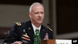 FILE - Lt. Gen. Scott Berrier, director of the Defense Intelligence Agency, testifies during a Senate Armed Services hearing on worldwide threats, May 4, 2023, on Capitol Hill in Washington.