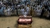 Relatives and mourners attend the funeral prayer of victims who were killed in Sunday's suicide bomber attack in the Bajaur district of Khyber Pakhtunkhwa, Pakistan, July 31, 2023.