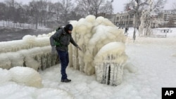Mist from the Great Falls has created a frozen wonderland around the waterfalls in Paterson, New Jersey, Jan. 18, 2024. 