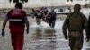 Russia Accused of Shelling Evacuees in Flooded Kherson 