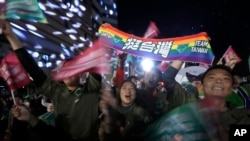 Supporters of Taiwan's 2024 presidential election candidate, Taiwan vice president Lai Ching-te, also known as William Lai, cheer after Lai's victory, in Taipei, Taiwan, Jan. 13, 2024. 