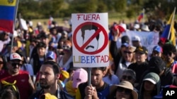 Venezuelan nationals protest against the results of their country's presidential election, in Quito, Ecuador, Aug. 3, 2024. 
