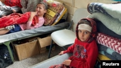 Wounded children take shelter in a school near Rafah in the southern Gaza Strip, Dec. 7, 2023.