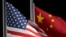 FILE - The U.S. and Chinese flags wave in Zhangjiakou, China, Feb. 2, 2022. The U.S. State Department recently modified its online fact sheet on China, dropping the country’s official name in favor of just using China.