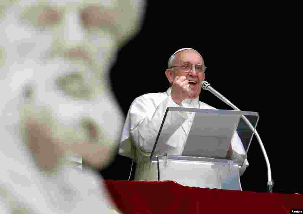 Pope Francis appears at the window of his future private apartment to bless the faithful, gathered below in St. Peter's Square, during the Sunday Angelus prayer at the Vatican March 17, 2013. 