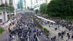 An estimated 800,000 protesters flock to the streets of Hong Kong to mark the six-month anniversary of the anti-government movement sparked by a controversial extradition law, Dec. 8, 2019.