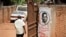 In this Thursday, Sept. 20, 2018 file photo, a man walks past graffiti in support of pop star-turned-opposition lawmaker Bobi Wine, whose real name is Kyagulanyi Ssentamu, in the Kamwokya neighborhood where he has many supporters.